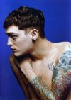 josh beech skull and flower tattoo on arm